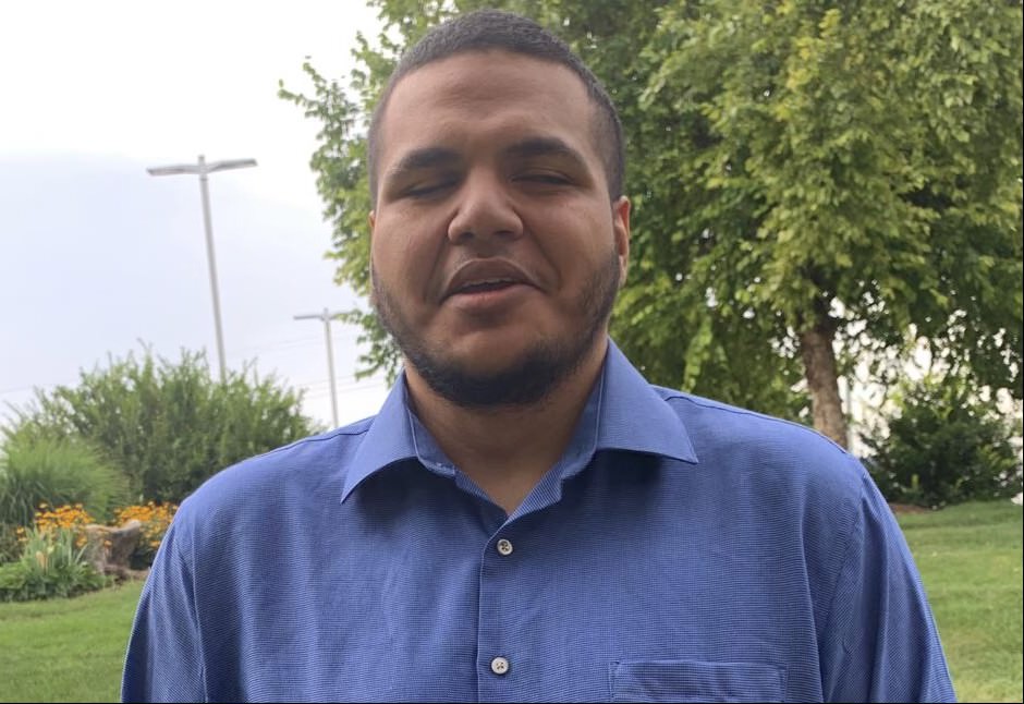 Danny Romero, the Blind Radio Guy, laughing outdoors